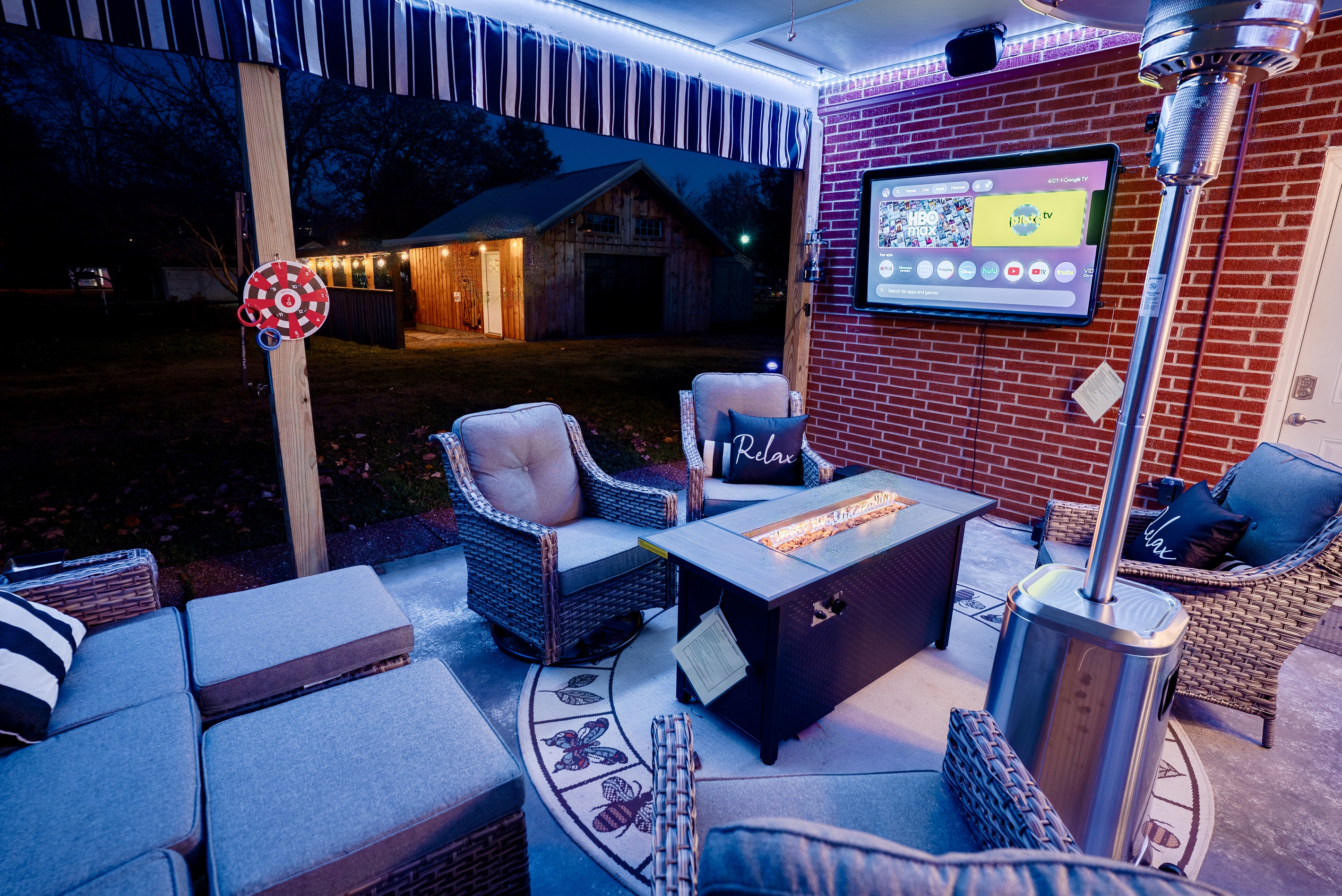 Relax on the private patio with outdoor TV, fire table and comfortable seating.