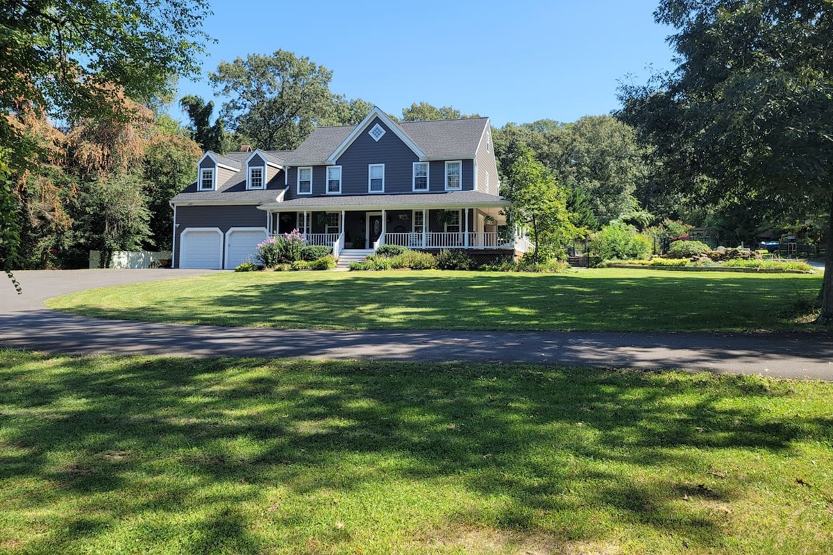 Front of House (4,125 Sq ft) with wrap around porch on 1 acre lot