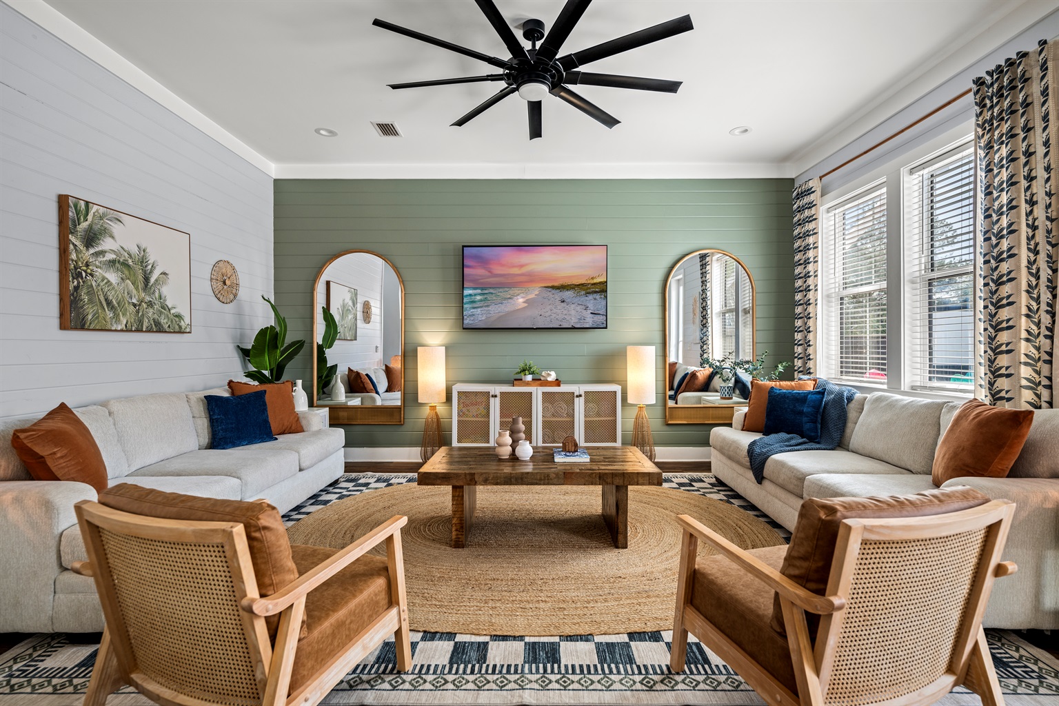 Bright, coastal, and made for gathering. This comfortable living room is the perfect place to relax after a day at Miramar Beach with plenty of seating for family and friends.