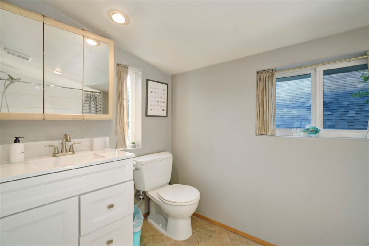 top floor bathroom with shower and tub.