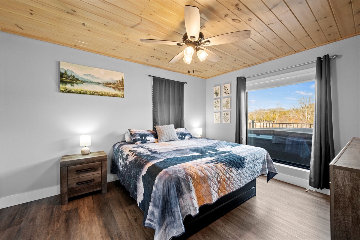 Bedroom with deck access, offering a peaceful place to step outside, enjoy fresh air, or start the day with a quiet moment.