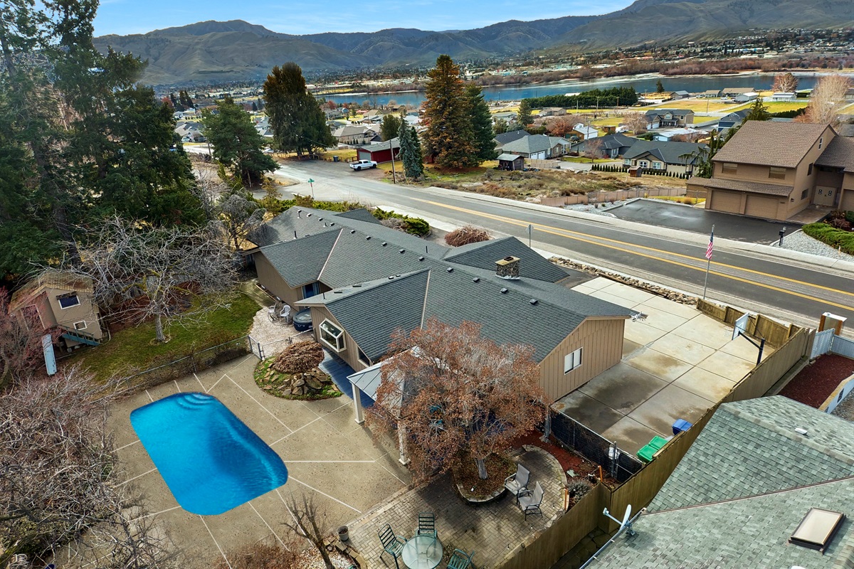 A private backyard with inground swimming pool with access to loop trail.