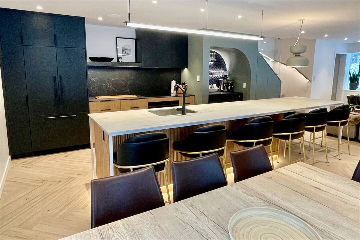 14ft heated island countertop + 4 leaf expandable dining table offers plenty of seating options 