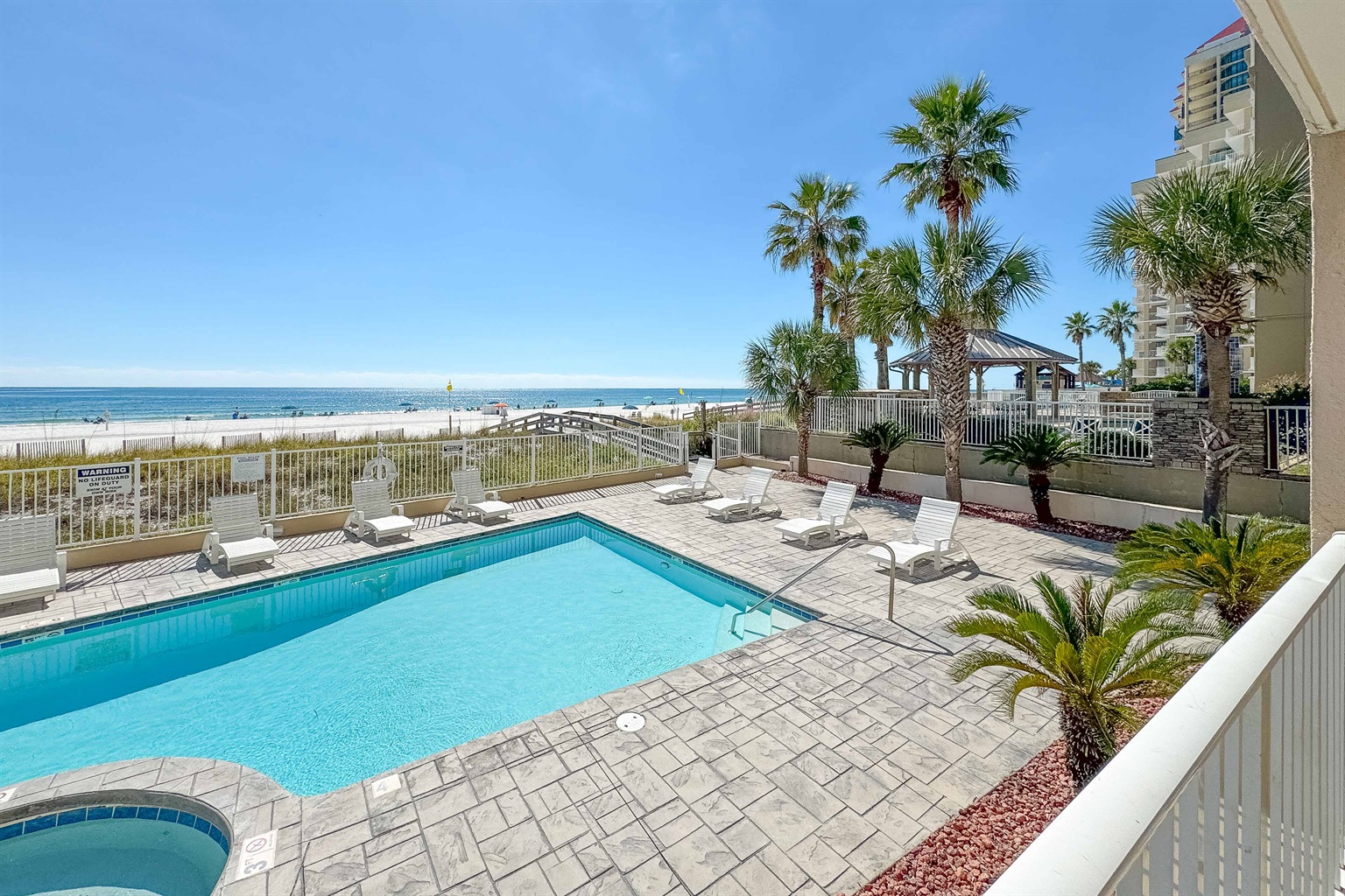 Private pool and direct beach access offer the ultimate coastal lifestyle.  Experience resort-style living at its finest.