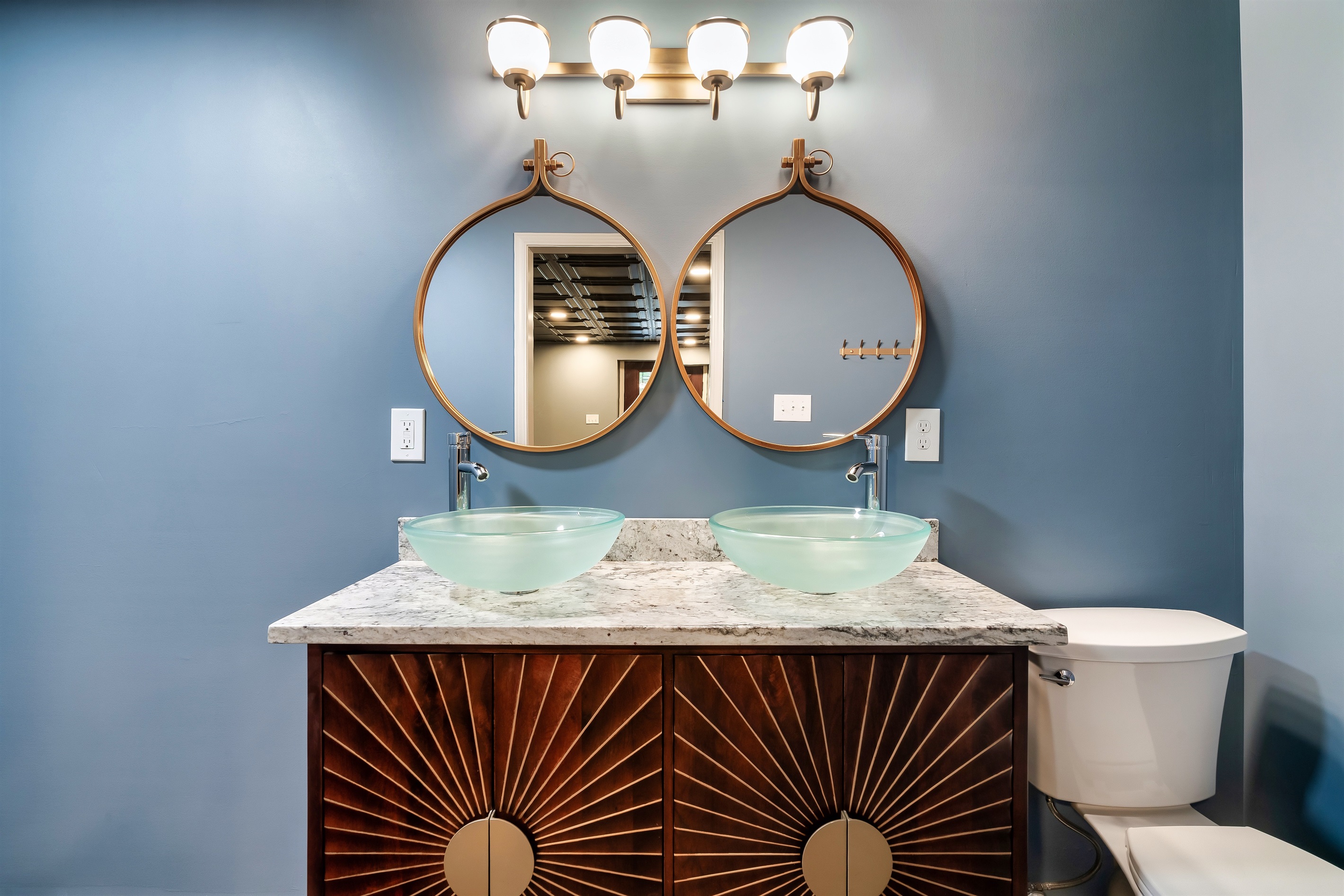 Function meets flair. Two sinks and plenty of counter space make getting ready a breeze. Enjoy the cool blue and warm wood tones.