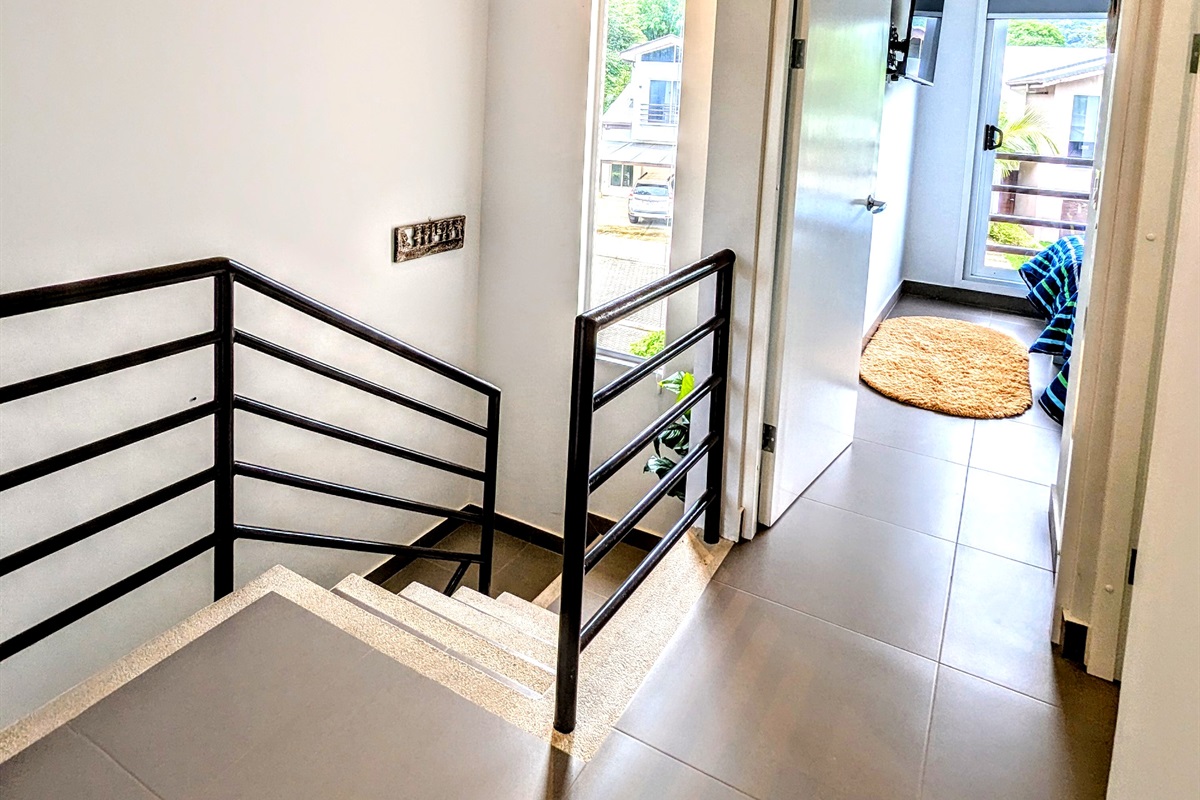Stairs and hall of the upstairs(guest bathroom on the right)