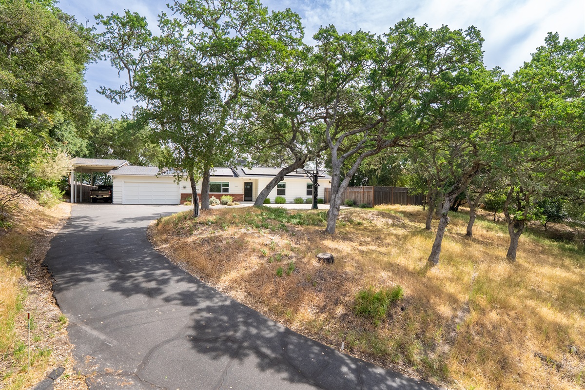 Escape to the quiet beauty of the hills, nestled under a canopy of oaks.