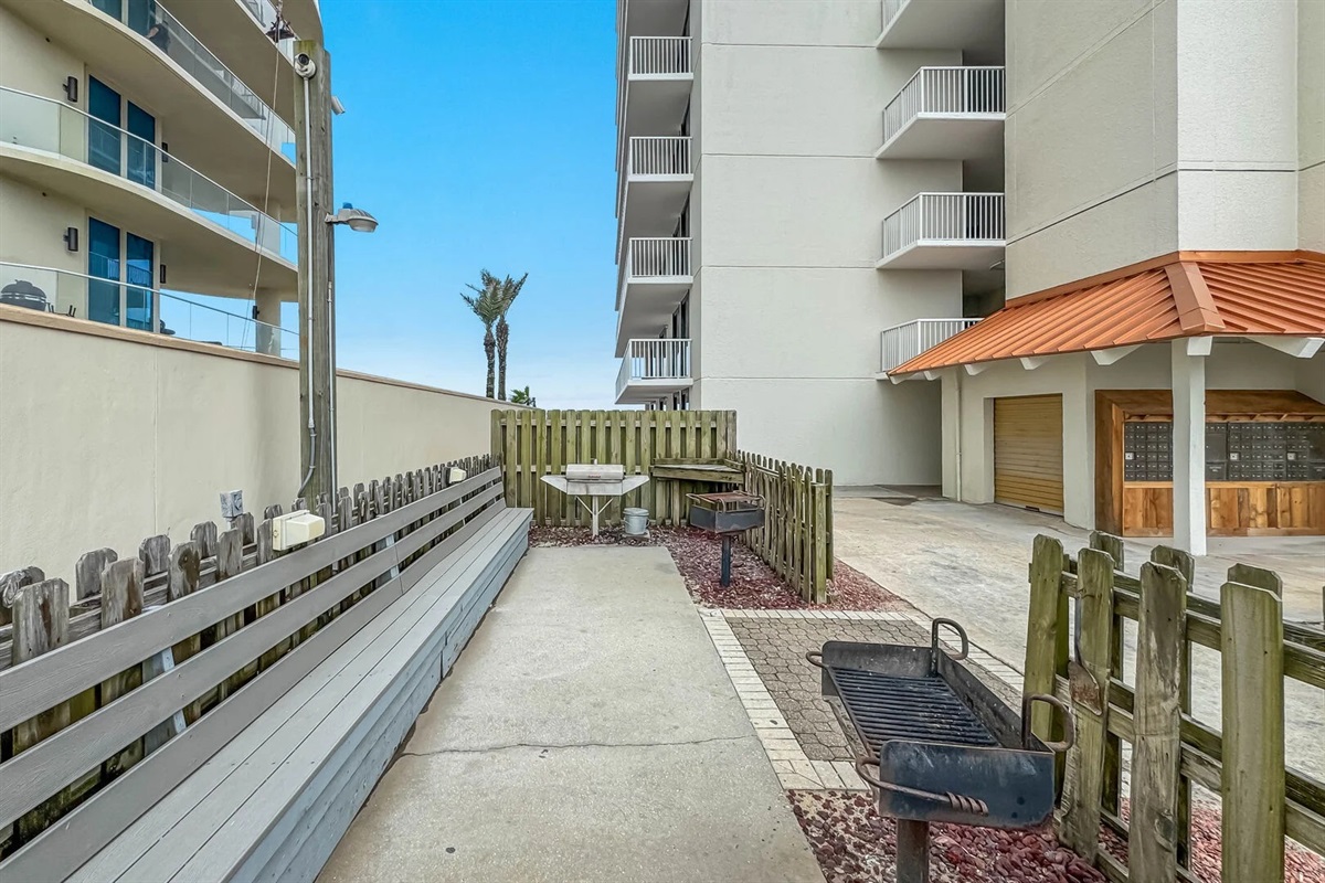 Charcoal grilling areas at East and West ends of the parking lot / builidings