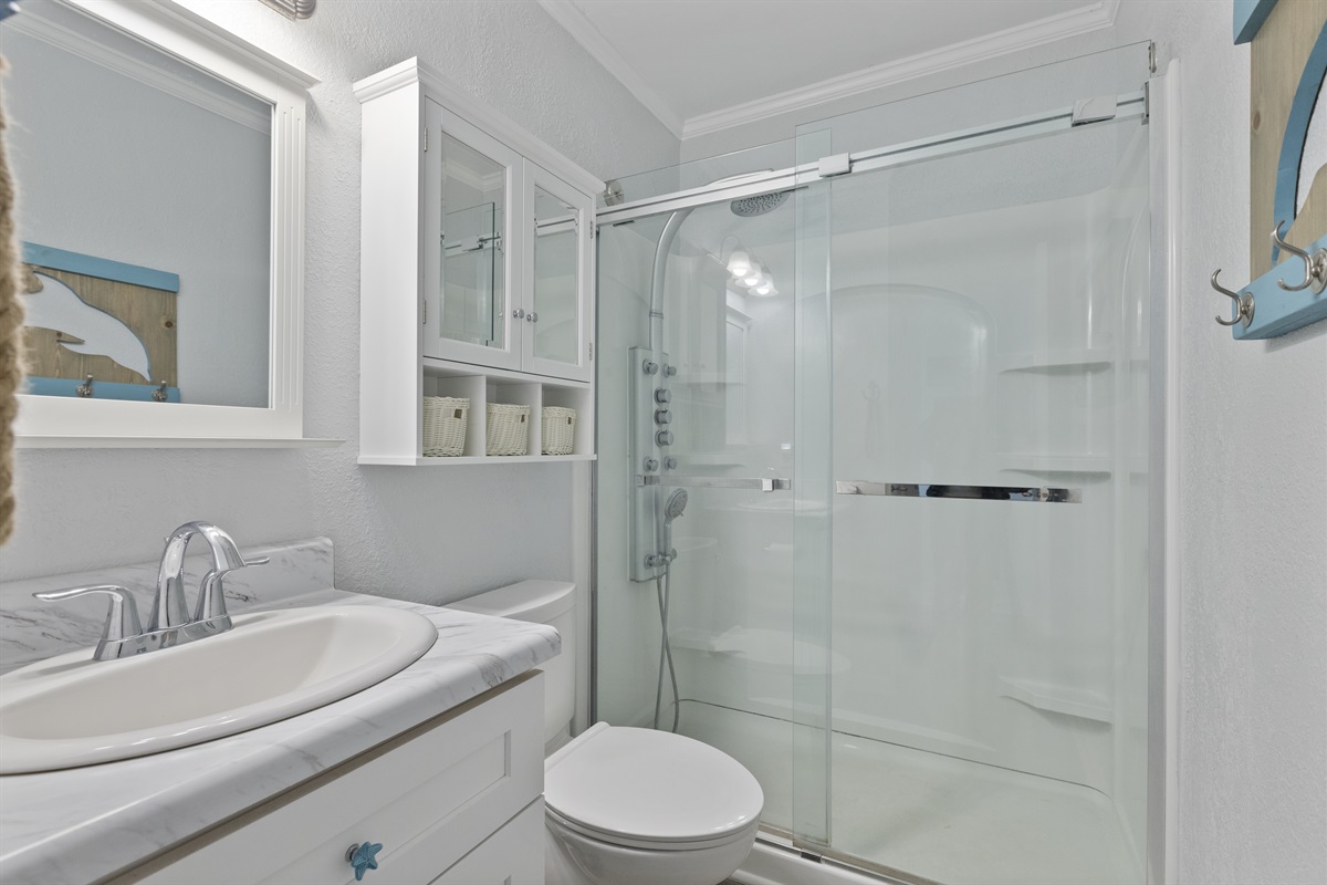 Clean Bathroom setup with plenty of storage options for personal items