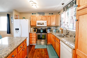 Explore the art of cooking in our fully-equipped kitchen, complete with utensils and kitchenware