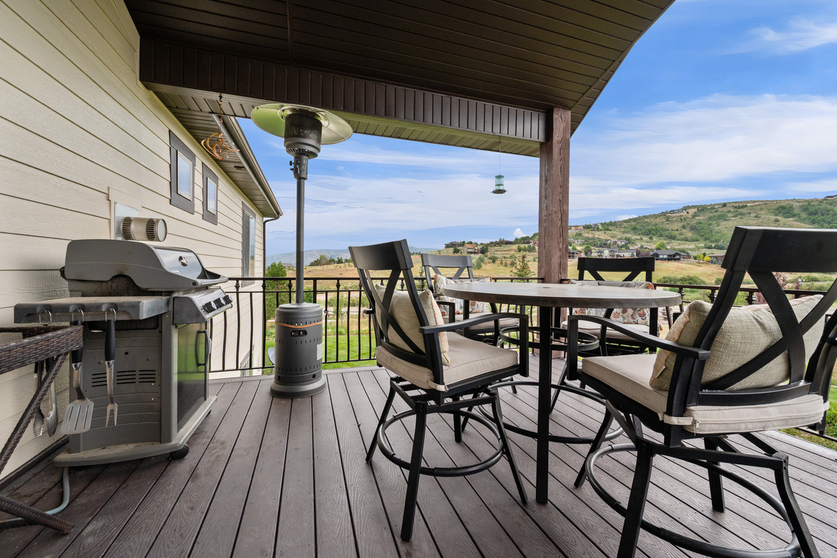 Relax on the covered deck with outdoor dining, BBQ grill, and panoramic views of beautiful Ogden Valley. Notice the propane heater to keep you warm on cool nights.