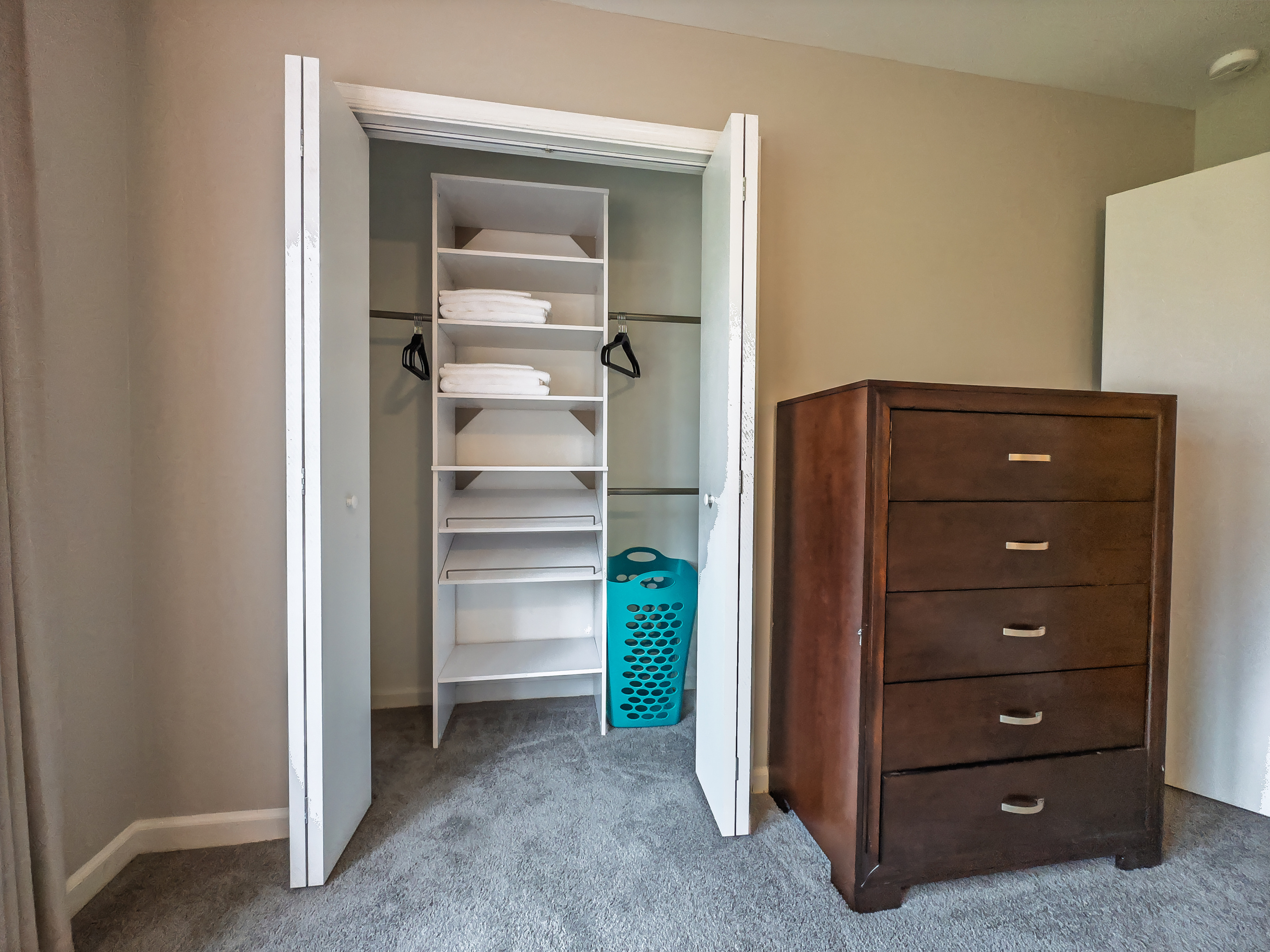 Primary Bedroom, King bed, 55" Smart TV, ceiling fan, two led light nightstands with multiple charging ports, two multi light function lamps, blackout curtains, dresser and closet, private full bathroom.