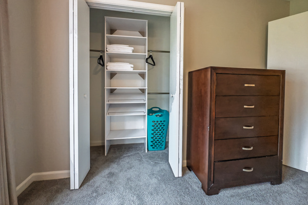 Primary Bedroom, King bed, 55" Smart TV, ceiling fan, two led light nightstands with multiple charging ports, two multi light function lamps, blackout curtains, dresser and closet, private full bathroom.