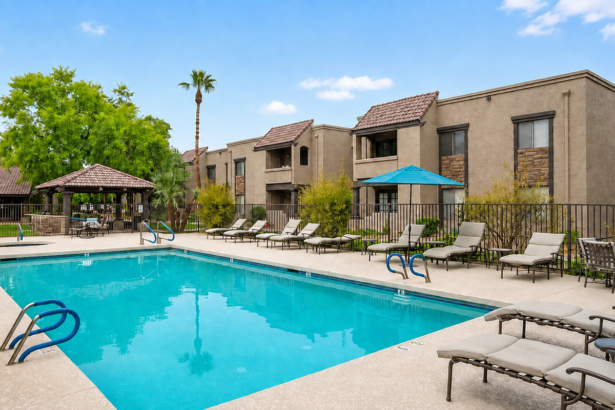 Shared community pool and spa area with lounge seating, sunny patio space, and room to unwind outdoors.