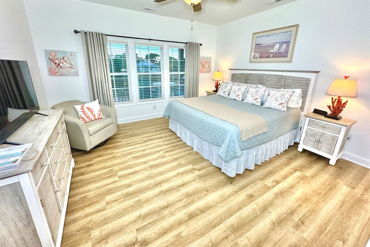 The master bedroom has a King bed, smart TV, blackout curtains, and water view.
