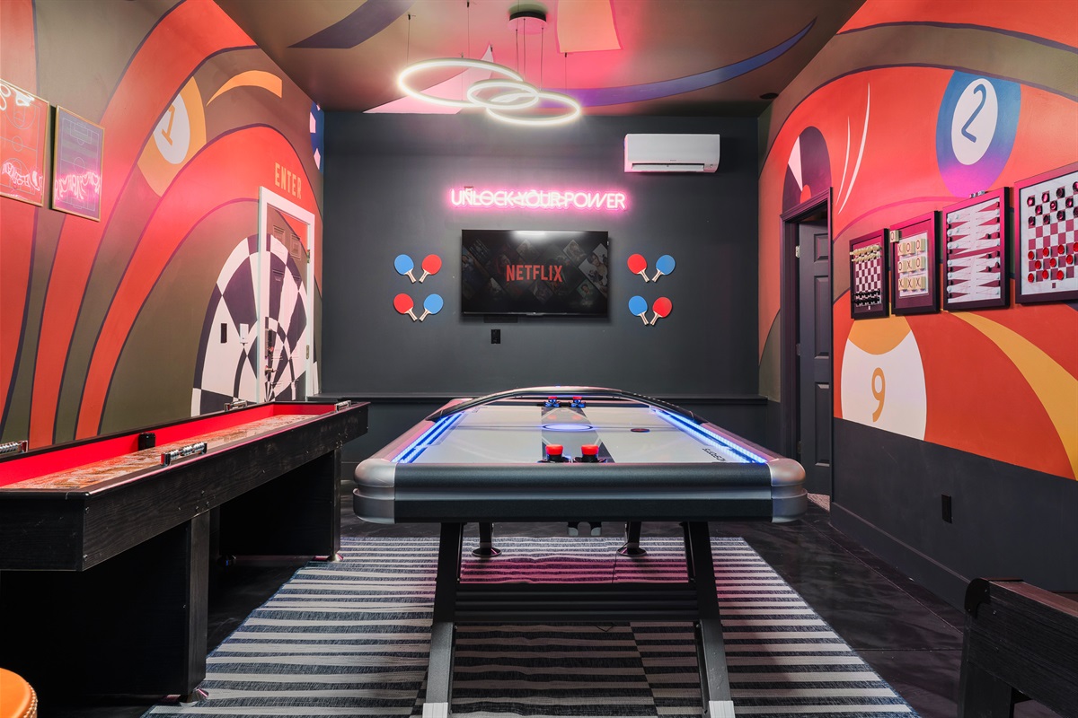 Dedicated game room with air hockey and custom design - perfect for all-day entertainment between Asheville outings