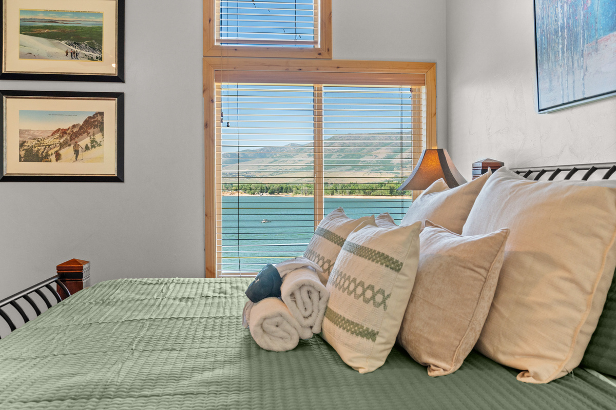 Large windows showcase the beauty of Pineview Reservoir and Ogden Valley.