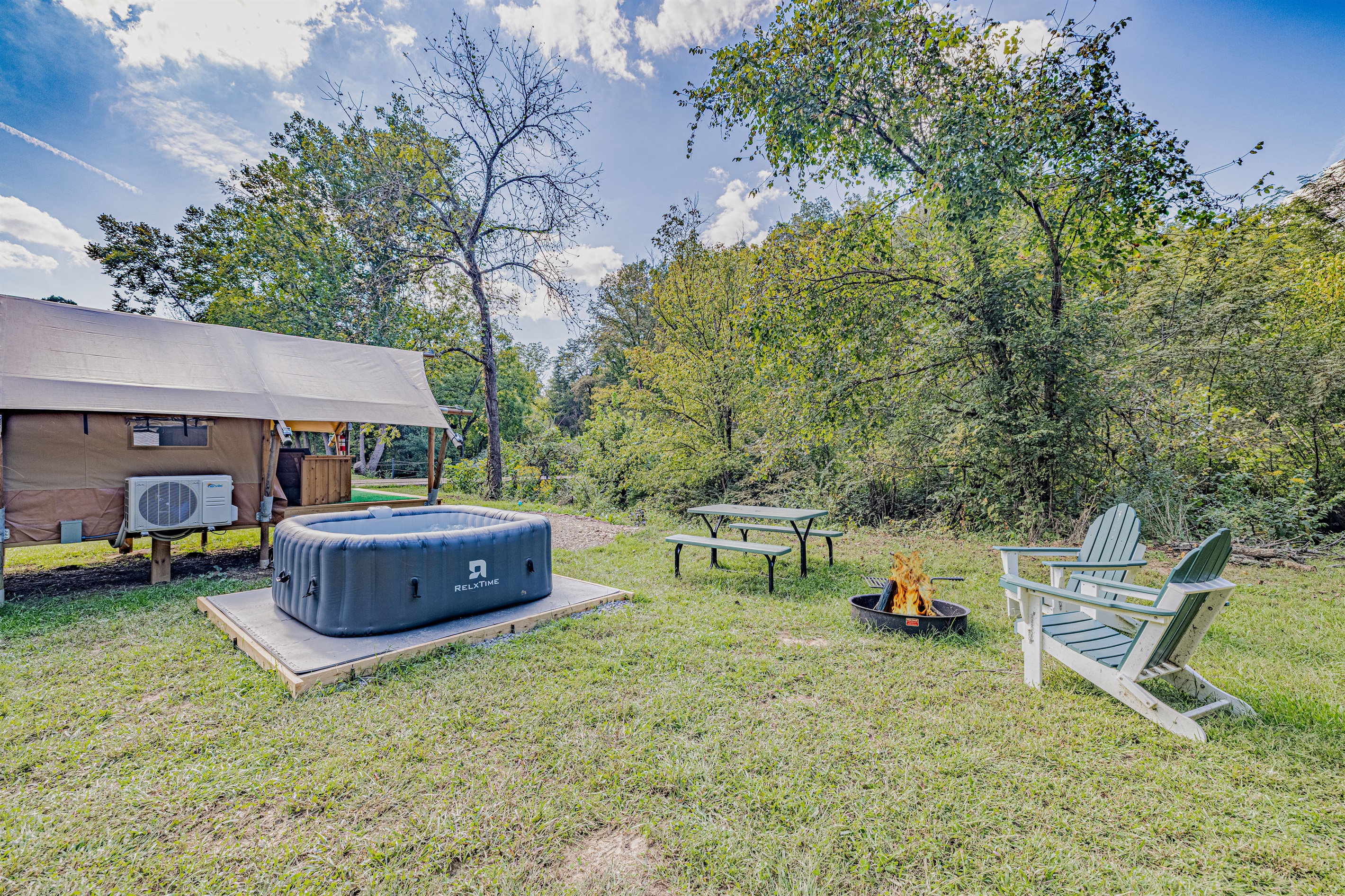 Find your favorite spot by the fire. The fire pit area is the heart of the backyard, ready for cozy nights and making memories.