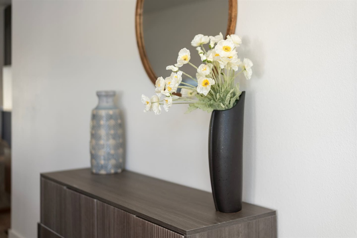 Fresh, elegant floral décor adds a soft pop of color and charm to the bedroom — designed to make the space feel bright, inviting, and serene.