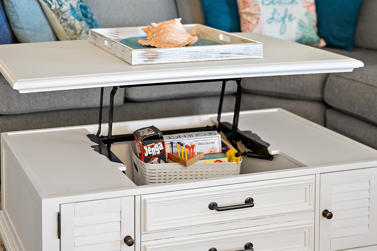 Coffee table raises to table height for game playing or  surfing your tablet
