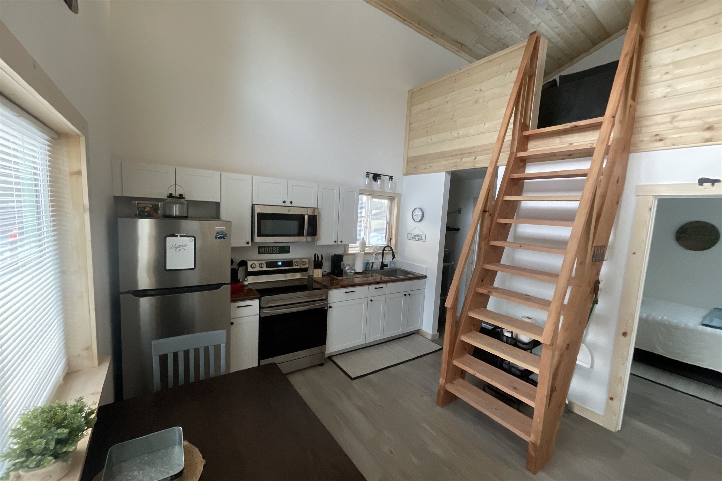 Main floor area.  Bedroom is to the right front.  Bathroom and laundry are to the right rear.  Ships ladder access to the loft living area and additional sleeping space.