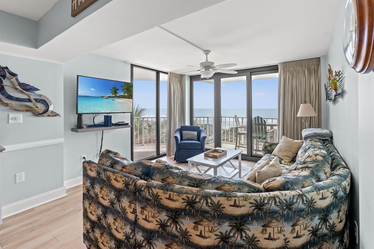 Spacious Living Room with oceanfront views and balcony