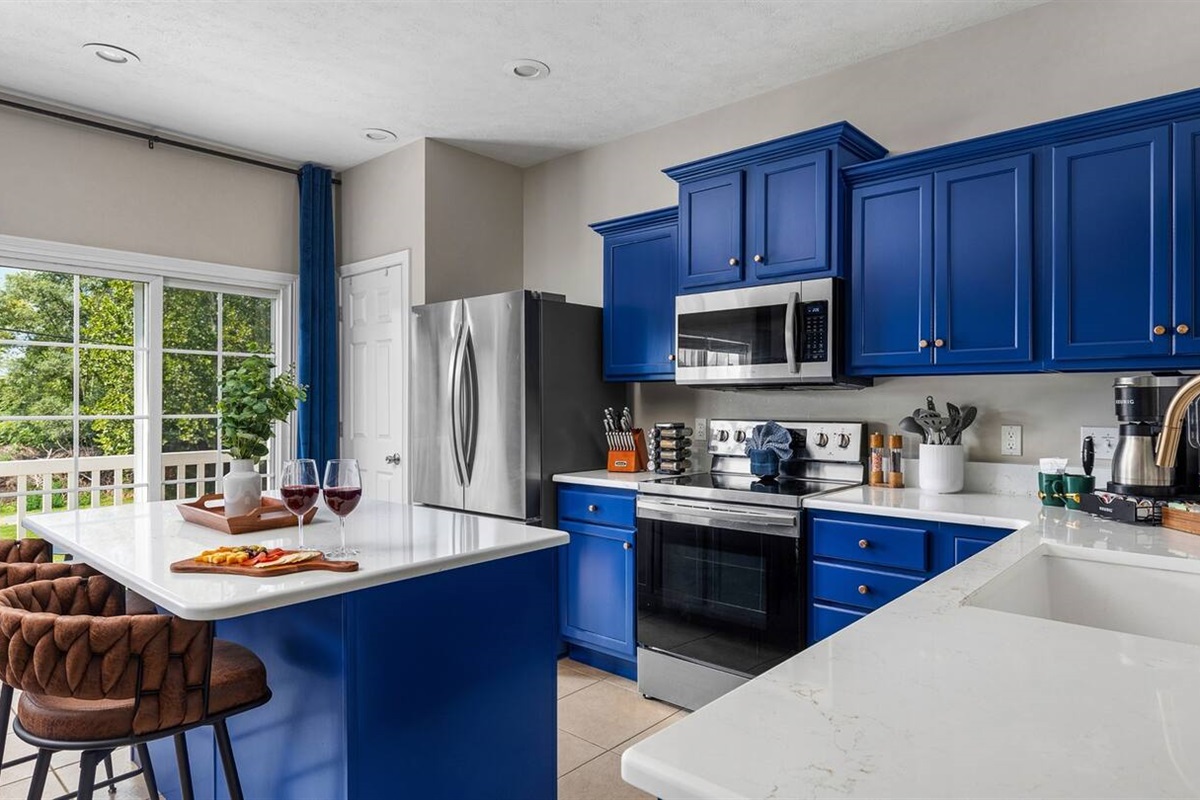 Fully stocked kitchen on the 1st floor with stainless steel appliances