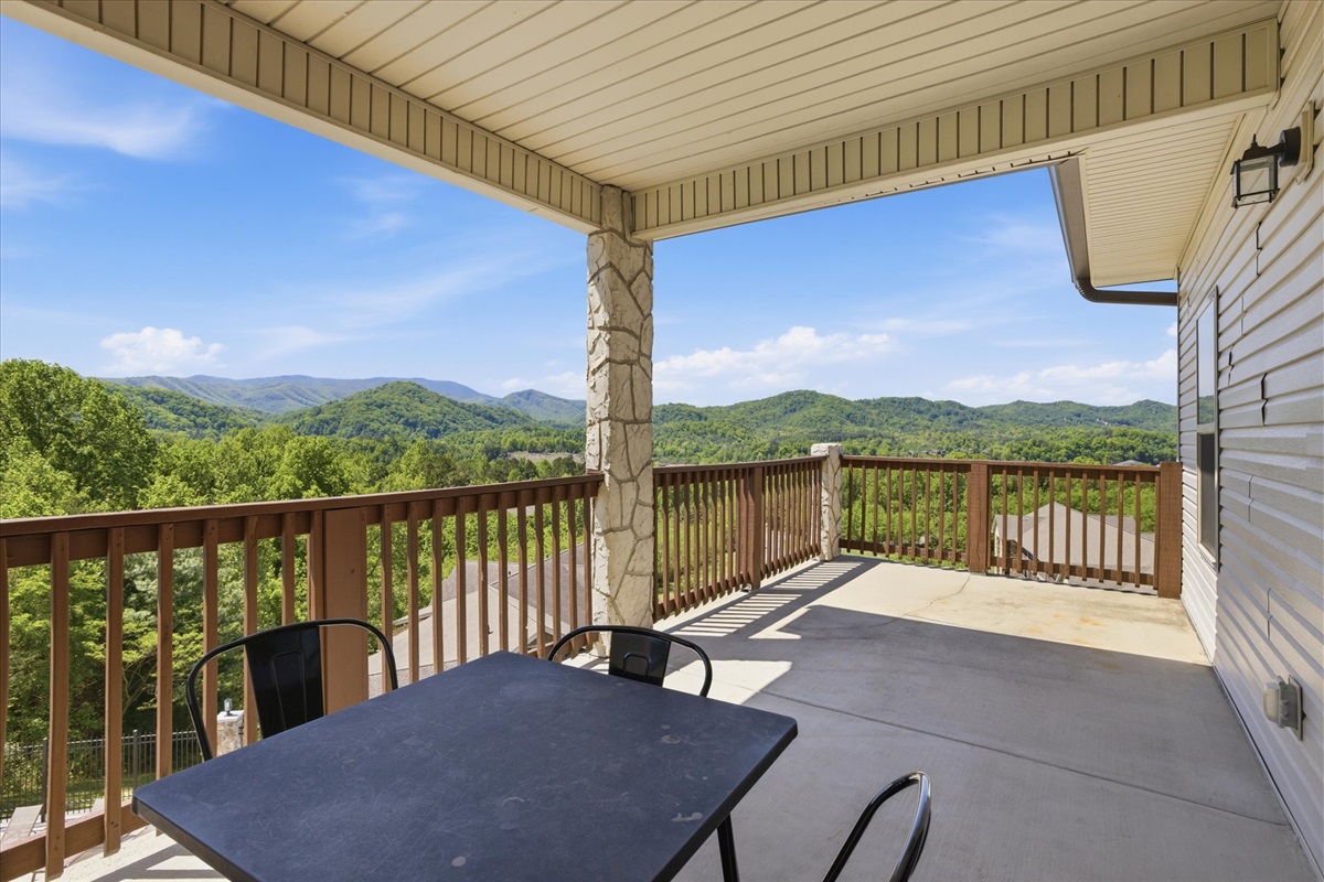 This is where the extra space really shows—loungers out, table set, and room to move around. It wraps just enough to give you options: sit, stretch out, or stay a while and let the view carry the moment.