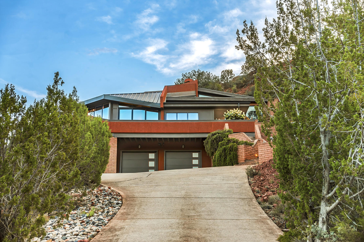 Driveway to paradise.  Garage and entrance.