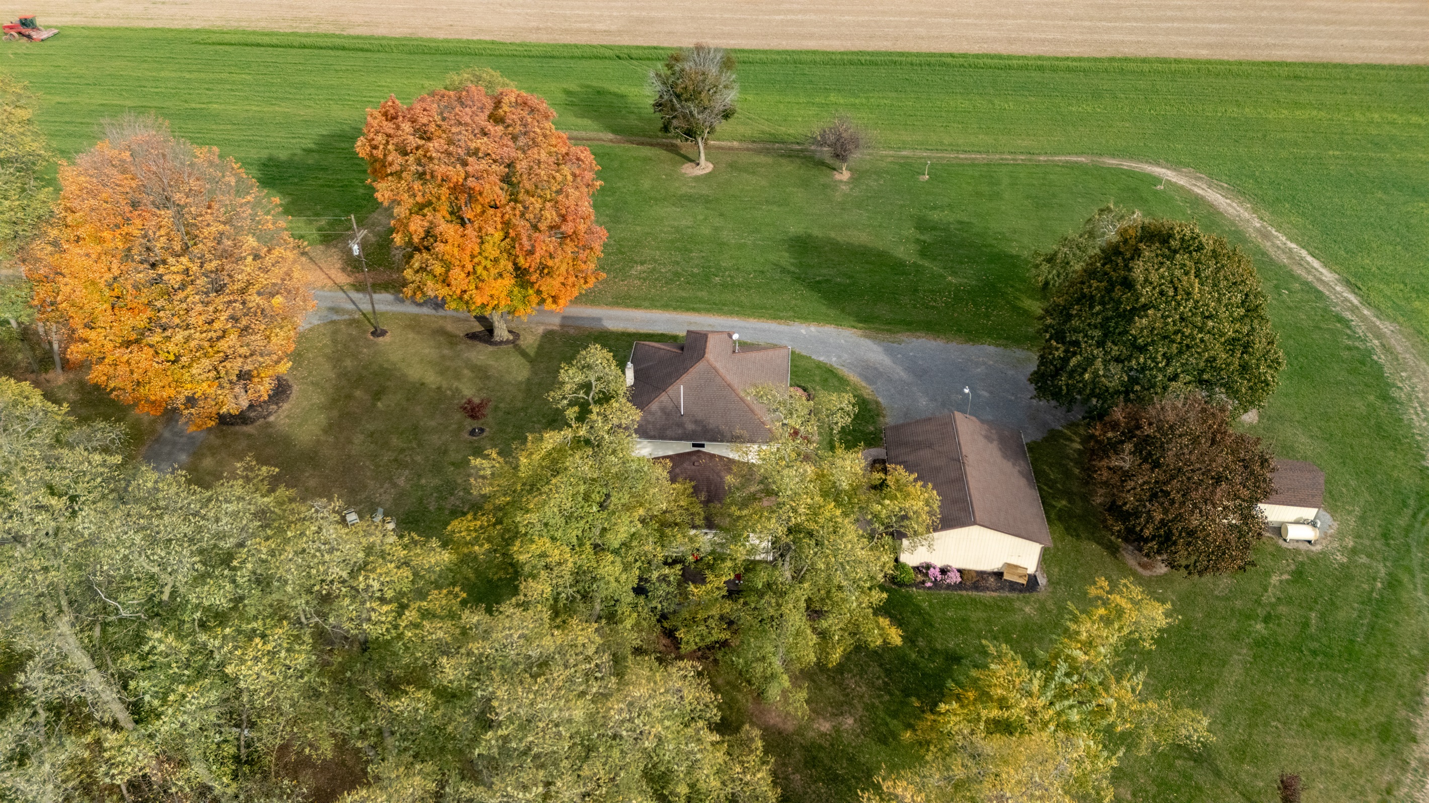 Vibrant foliage frames this cozy home — the perfect autumn hideaway