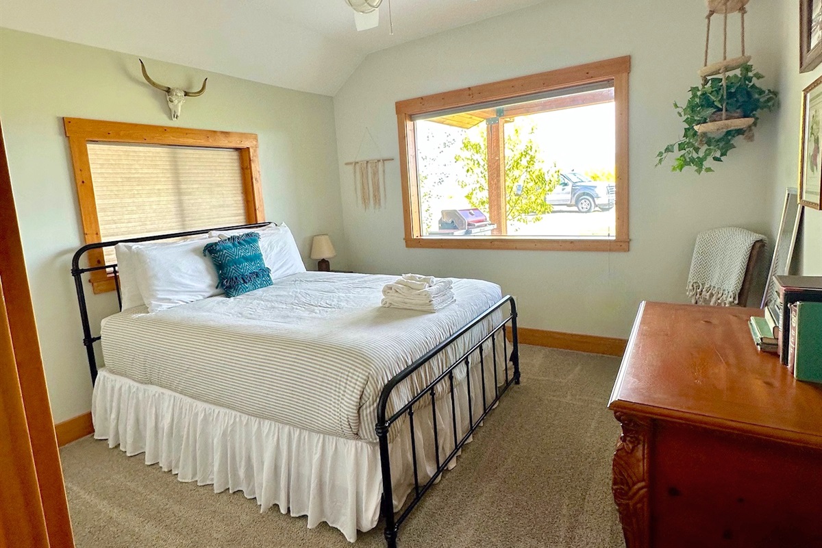 Bedroom # 4 features a queen bed and plenty of storage for your belongings.