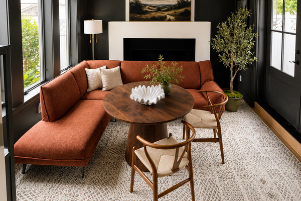 This cozy gathering space is perfect for meals, games, and conversation. Featuring comfortable banquette seating, a round table, and a warm fireplace backdrop, it's an inviting spot to enjoy morning coffee, family game night, or an evening with friends.