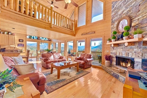 Relax by the fireplace and gather around the spacious living room at Little Cub Cabin