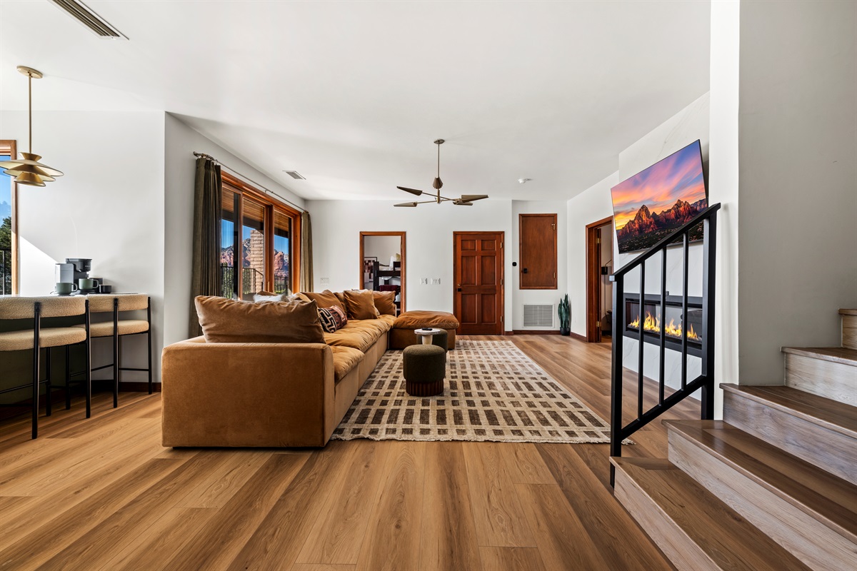 Downstairs Living Room
Spacious living area with comfortable seating and modern fireplace.