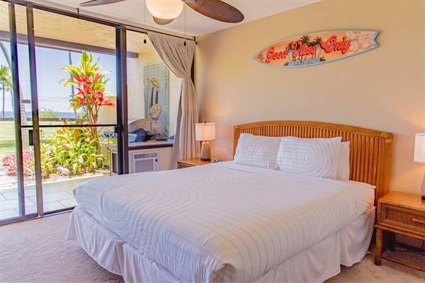 Master bedroom with king bed, with ubobstructed view of the ocean and golf.