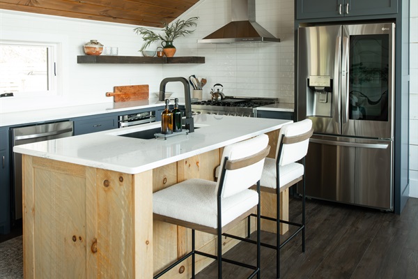 Kitchen | Custom wood island beneath soaring vaulted ceilings