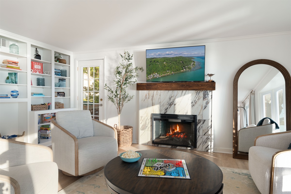 Enjoy movie night in the living room with a bowl of popcorn, with the fireplace on for added ambience. 