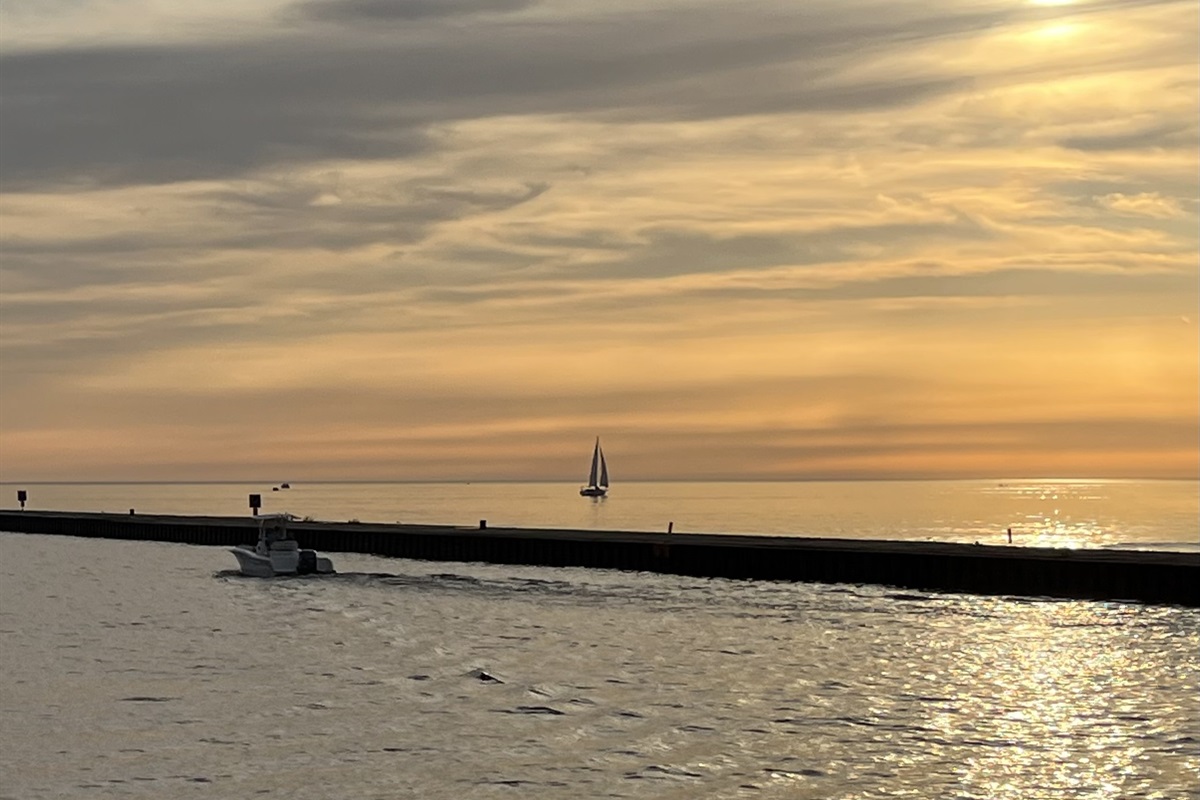 A favorite pastime! Watching boats go in and out of the Black River to Lake Michigan. Grab an ice cream cone and enjoy the view!