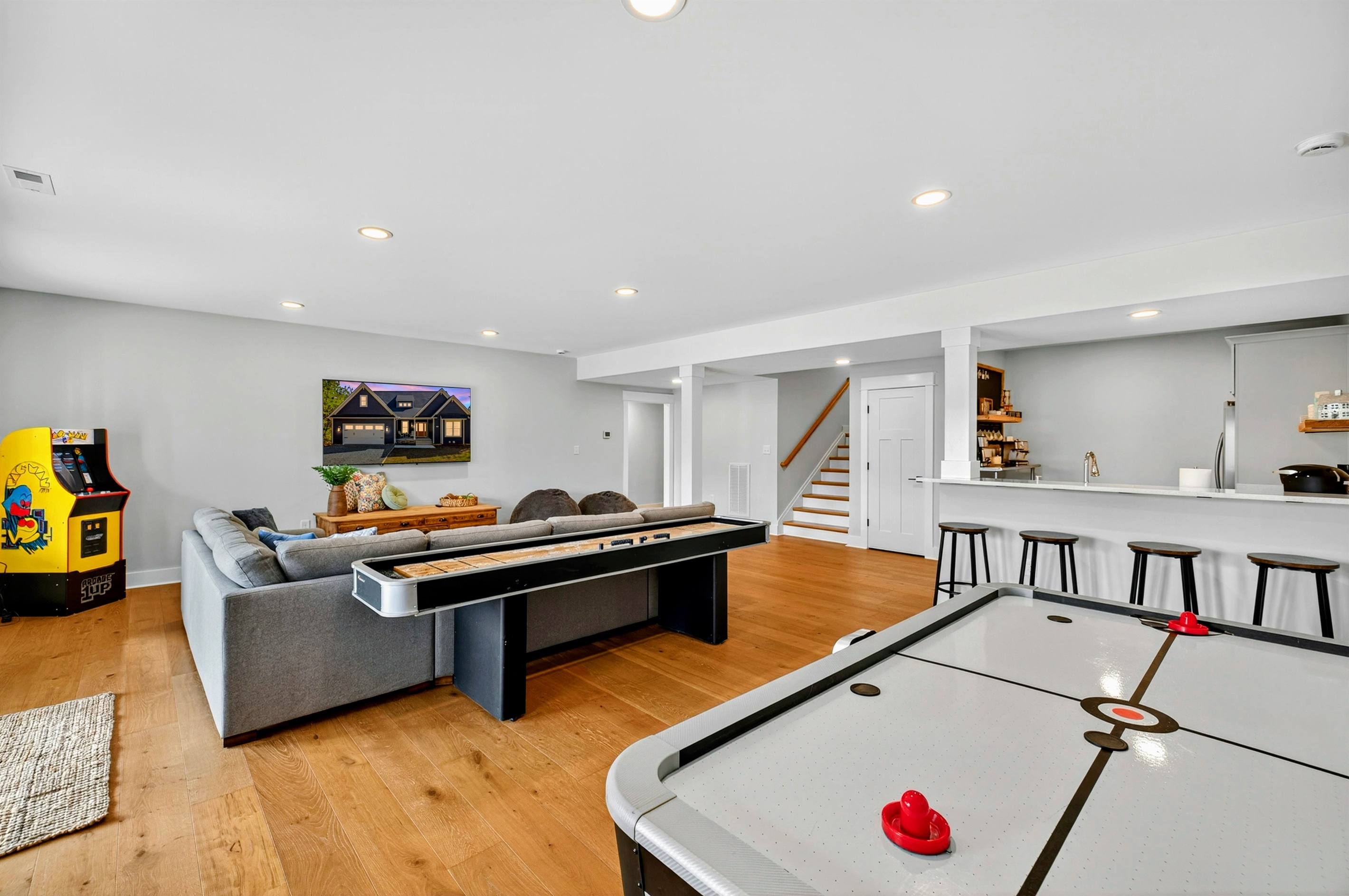 Amazing basement perfect for family's vacationing together w/ kitchen & coffee bar, and two kings and quad bunk room. Game room has it all: arcade game, shuffleboard, air hockey, ping-pong!