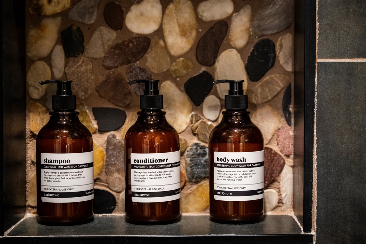 🧴 Skip the suitcase shampoo. We’ve stocked the good stuff—salon-grade, refillable, and easy on the planet.