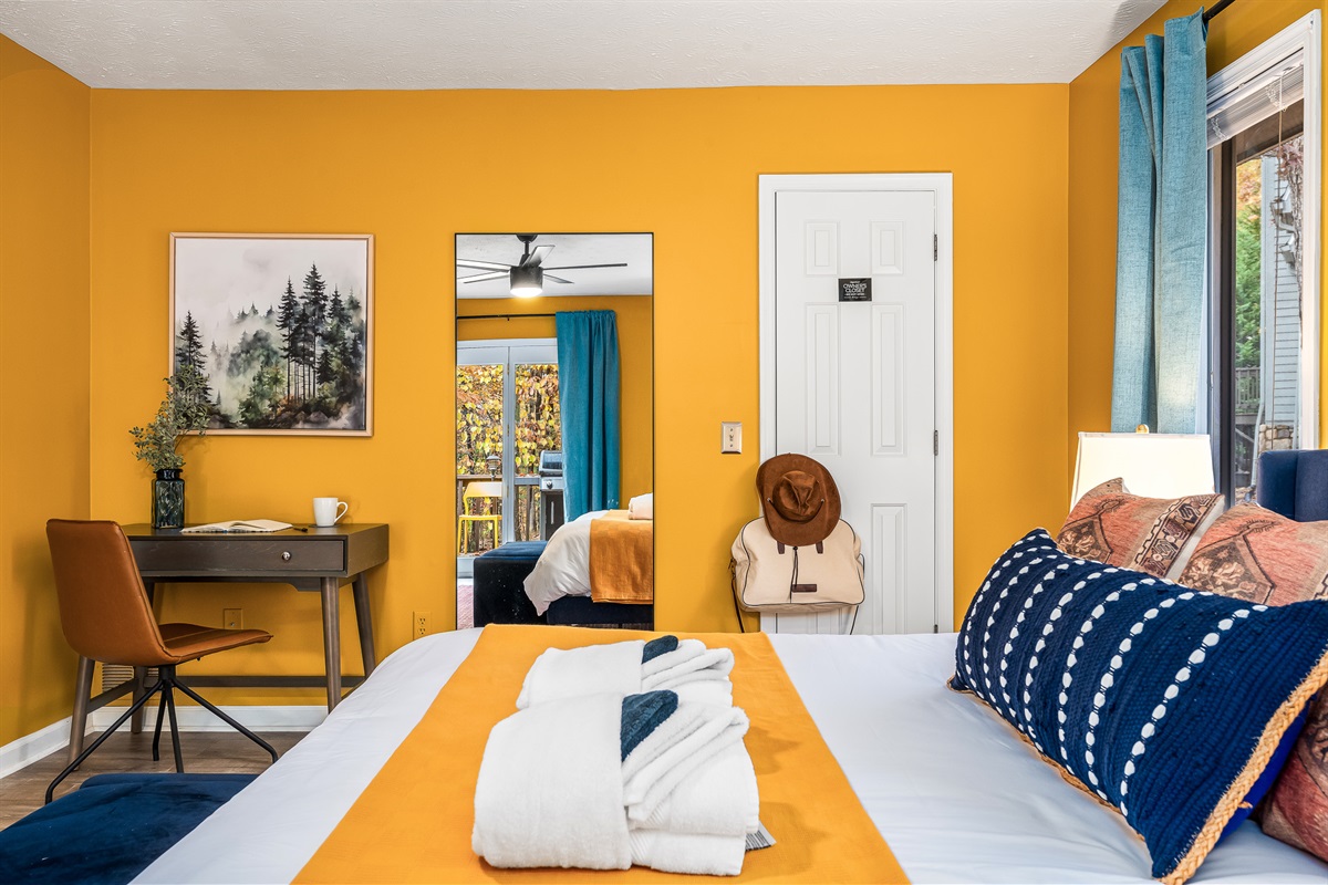 A cheerful, cozy bedroom retreat with its own workspace — ideal for quiet mornings or a little ‘me time