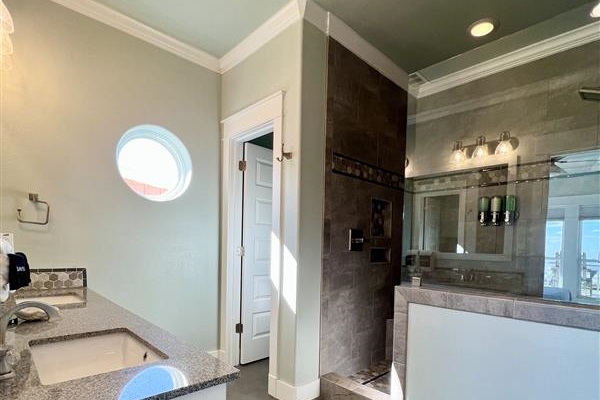 Crystal Paradise Bathroom 4: Our bathrooms include contemporary vanities with quartz countertops, elegant fixtures, and oversized mirrors, offering both function and style.