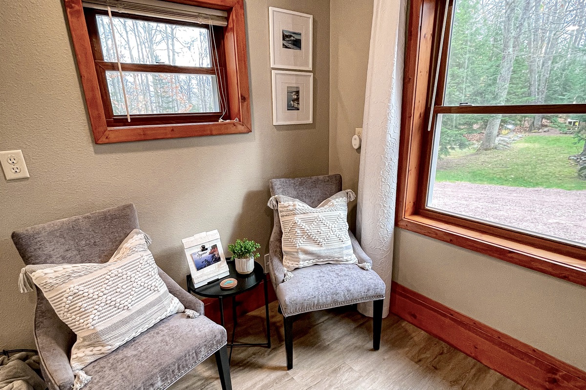 Bedroom lower level seating area next to the large window    *note this is main lower entry level must take stairs to access upper loft kitchen living bathroom* 