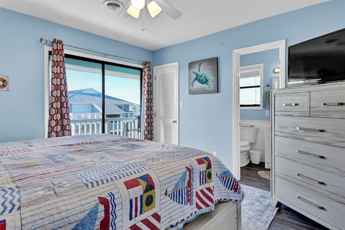 The primary suite offers access to a small, private balcony