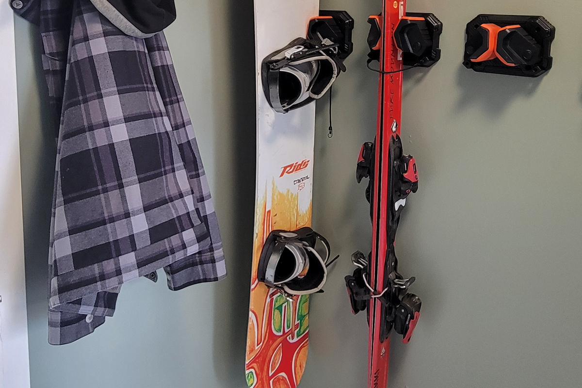 Ski and snowboard racks in mudroom plus large hooks for drying gear.