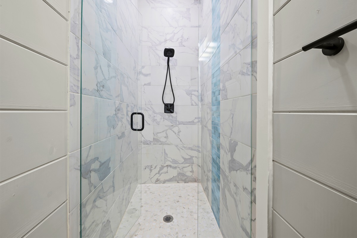 Soak in tranquility in a clean, sleek space designed with a spa-like shower to wash away your stress.