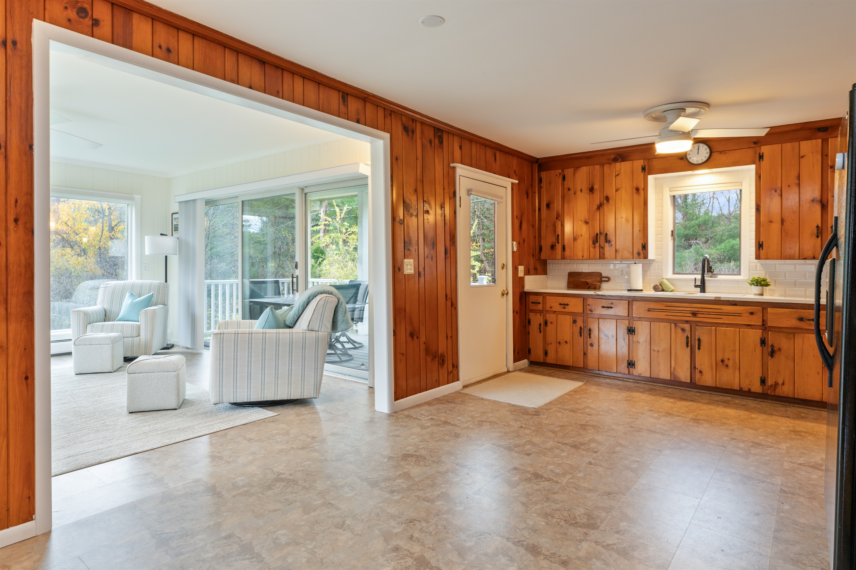 Spacious kitchen extending into the four season room