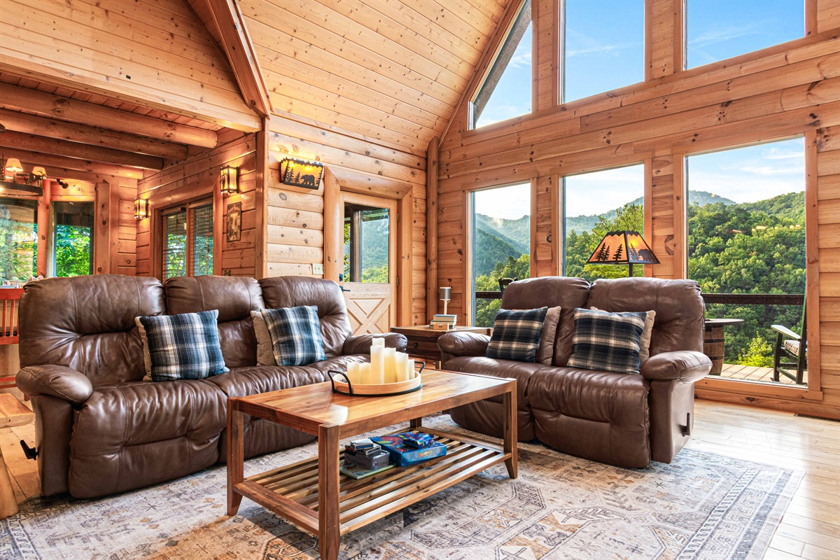 Main Level Living Room: Warm wood tones and stunning views invite you to relax and recharge!