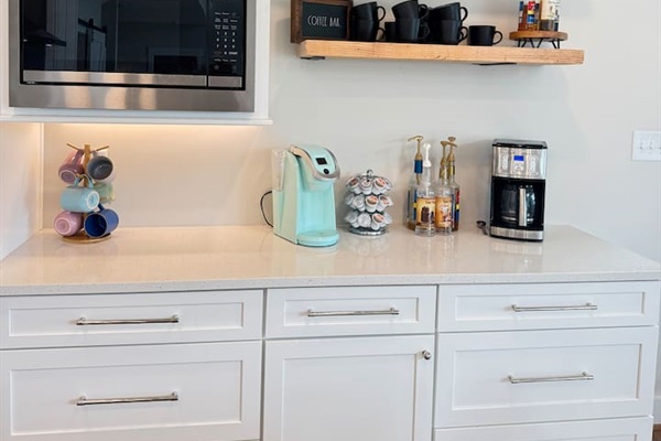 Coffee lovers will love our mini coffee bar in the kitchen. we offer a great selection of specialty coffee syrups as well as a Keurig, pods, coffee, grinder, and regular drip coffee maker.
