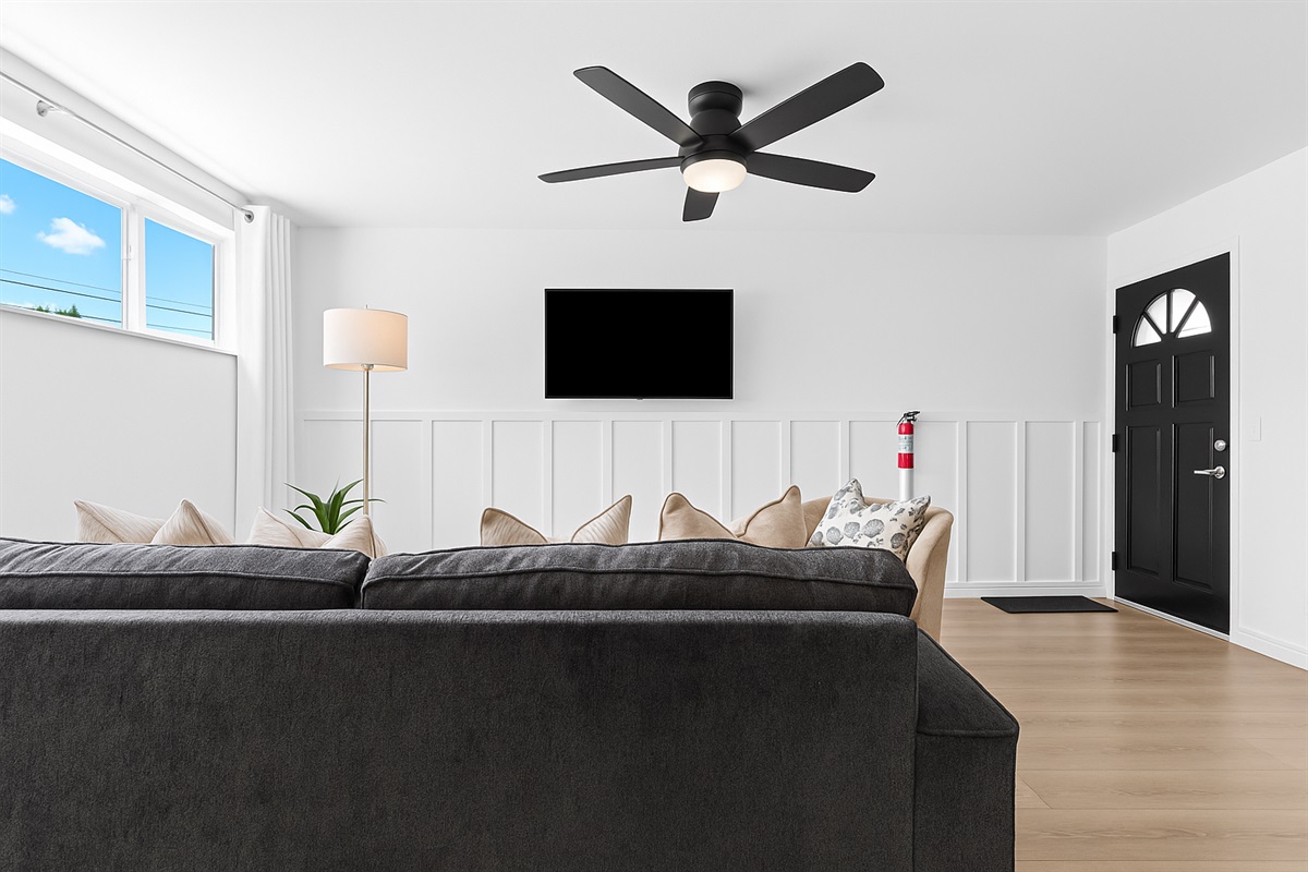 Natural light pours into this inviting space, creating a cheerful ambiance for reading, lounging, or entertaining.